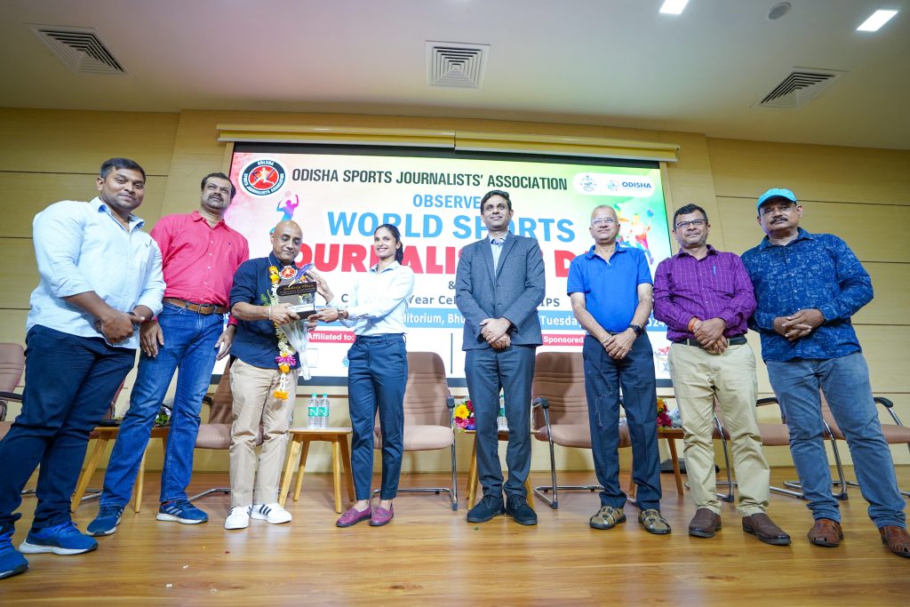 An award being presented during the World Sports Journalists Day celebrations in Bhubaneswar on July 2