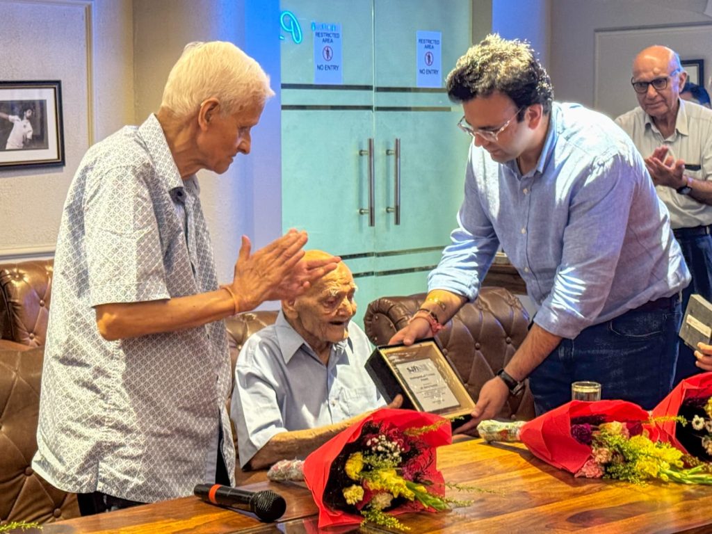 DDCA President, Mr. Rohan Jaitley, presenting the SJFI medal to Mr. Kewal Kaushik while Mr. C.S. Ramachandran (left) watches on.
